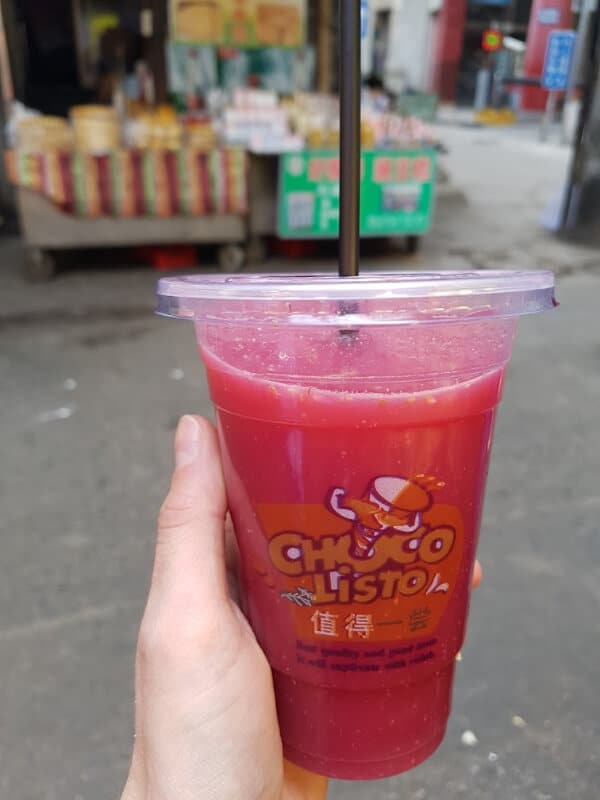 cool things to see in Xi'an: I am holding fresh pomegranate juice
