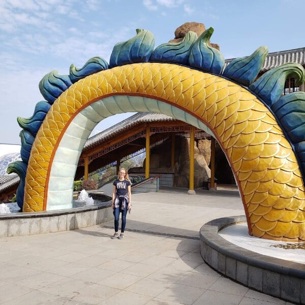 I am standing underneath a section of the dragon at the Wanda theme park in Nanchang 