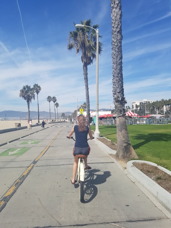 Southern California Itinerary: I am biking down the boardwalk in Venice 