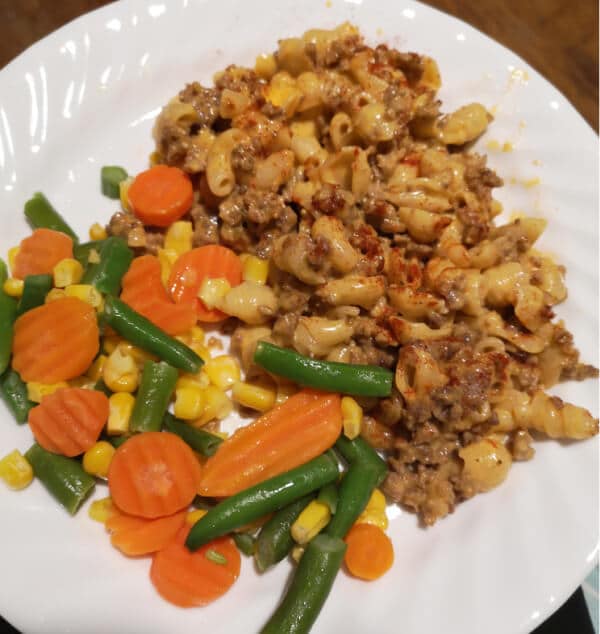 a plate of mac and cheese and hamburger with a side of mixed veggies: what to make in quarantine