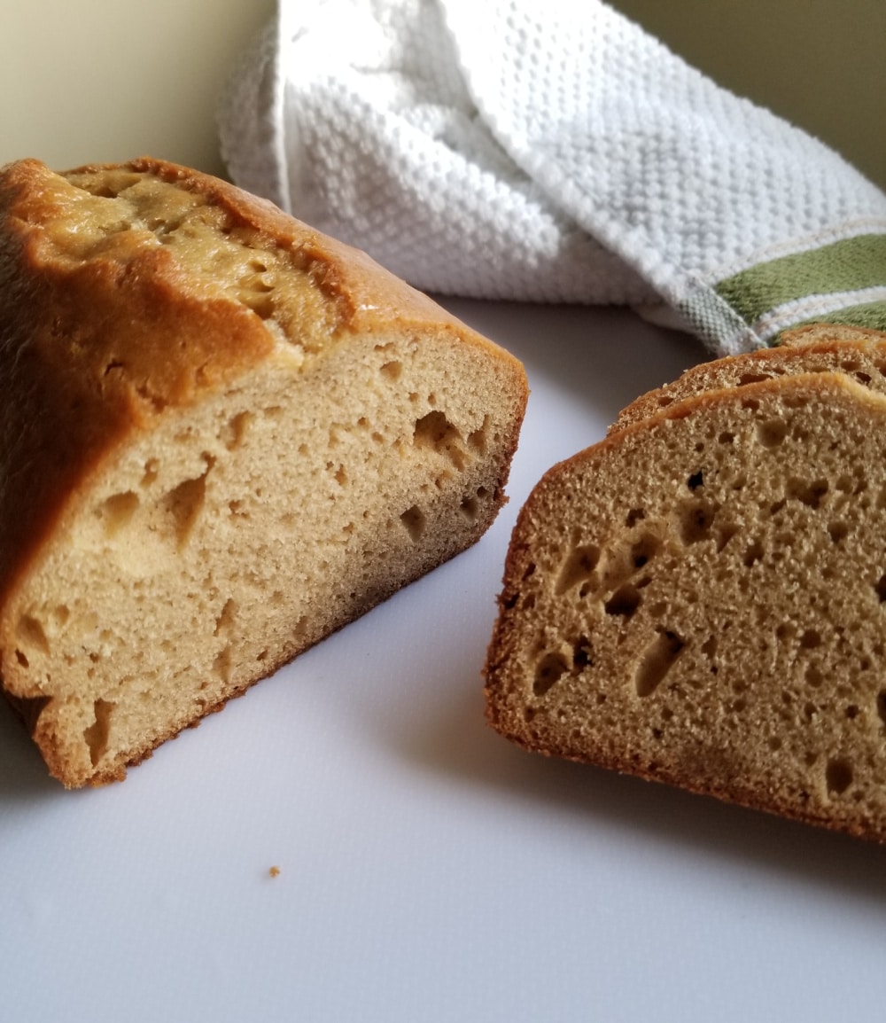 Peanut butter bread loaf with a few slices cut out