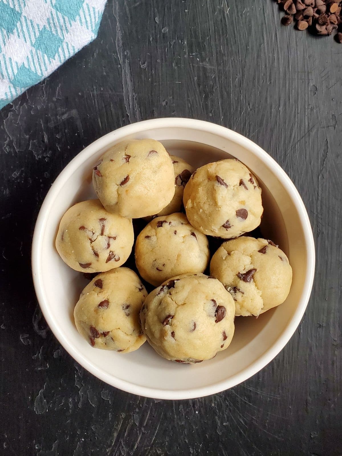 A bowl of chocolate chip cookie dough bites. 