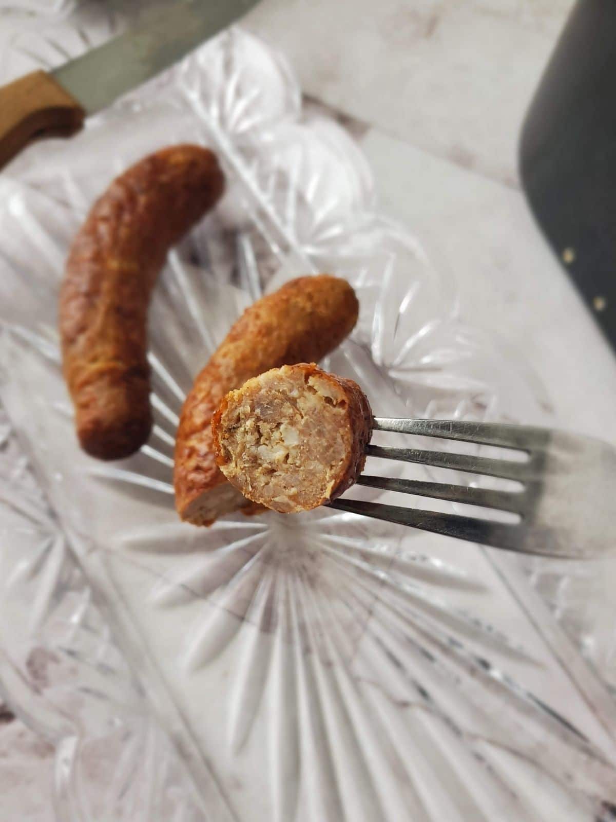 A for holding a bite of a sausage cooked in the air fryer. 