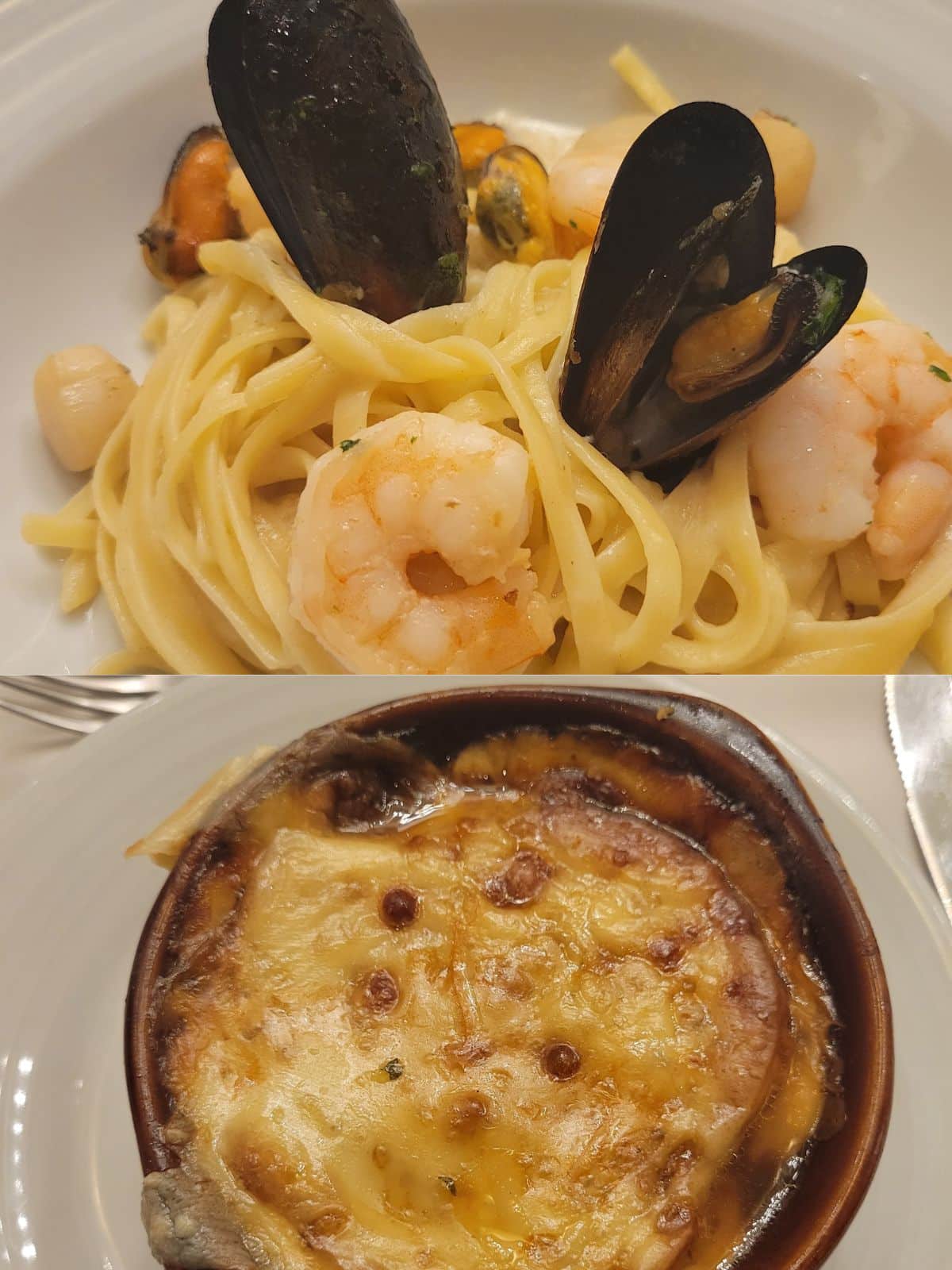 A bowl of French onion soup with tons of melted cheese on top and a dish of seafood linguine topped with shrimp and mussels. 