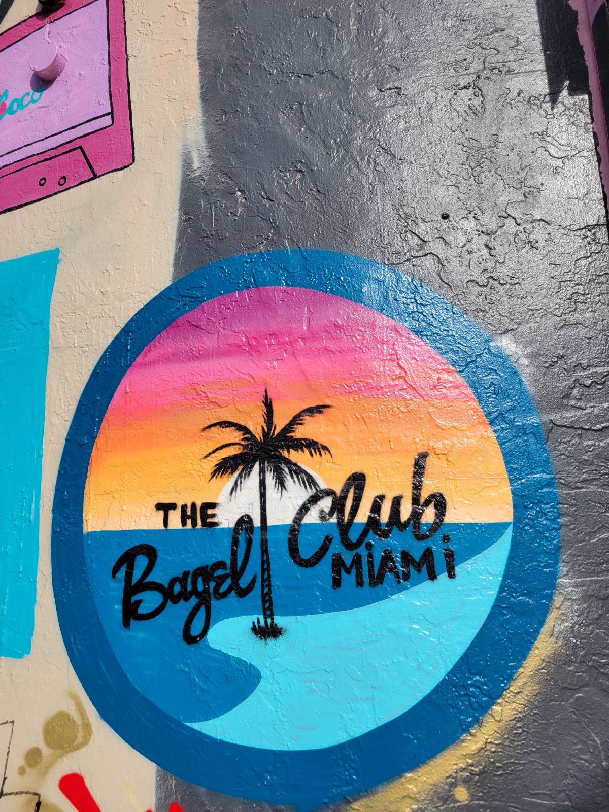 The colorful Bagel Club Miami logo.